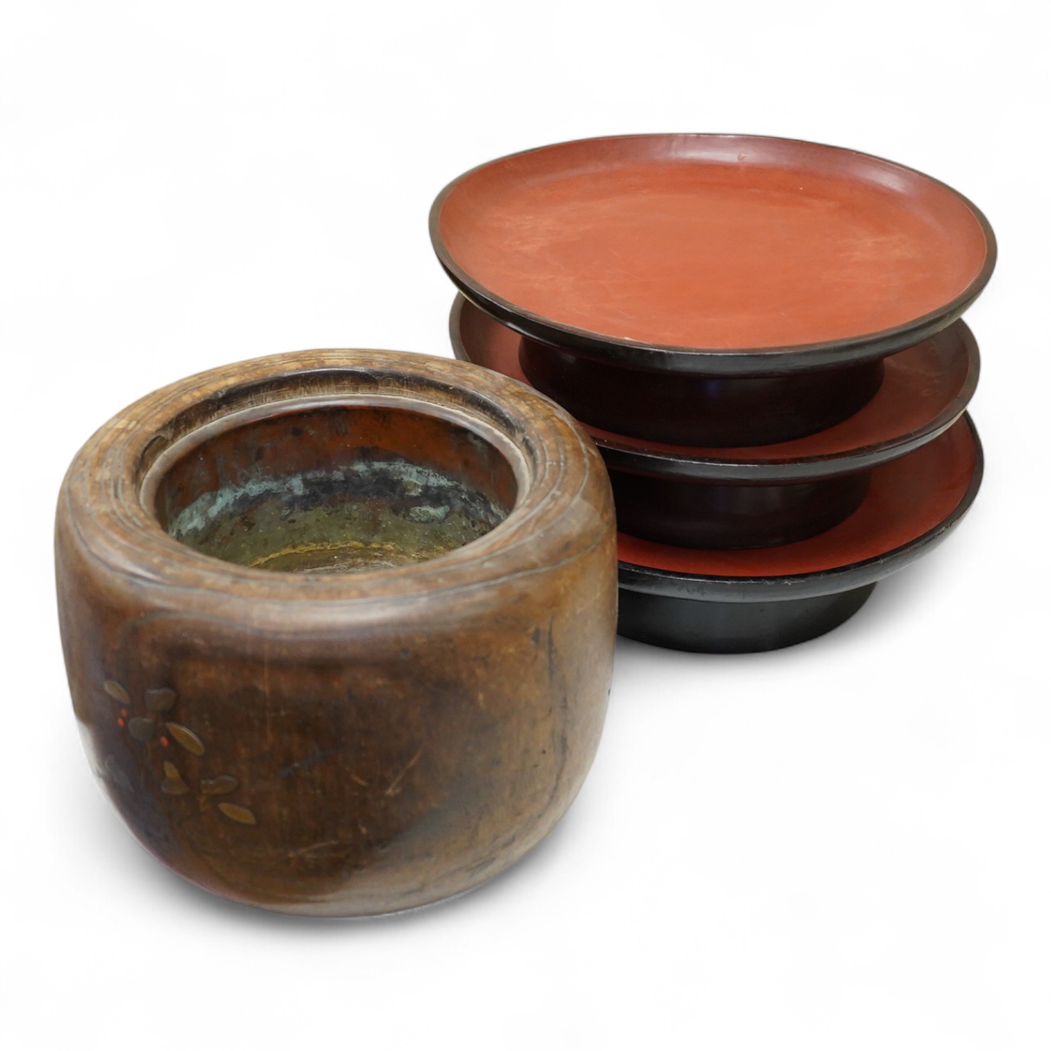 A Japanese lacquered paulownia wood hibachi, 20.5cm high and three Burmese lacquer stands